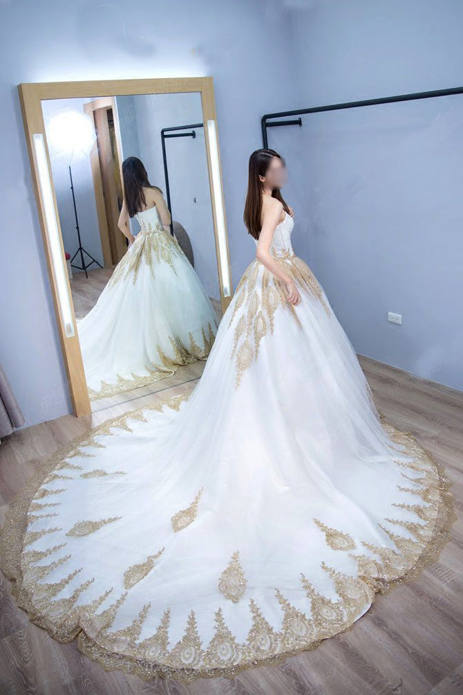 white and gold wedding dress